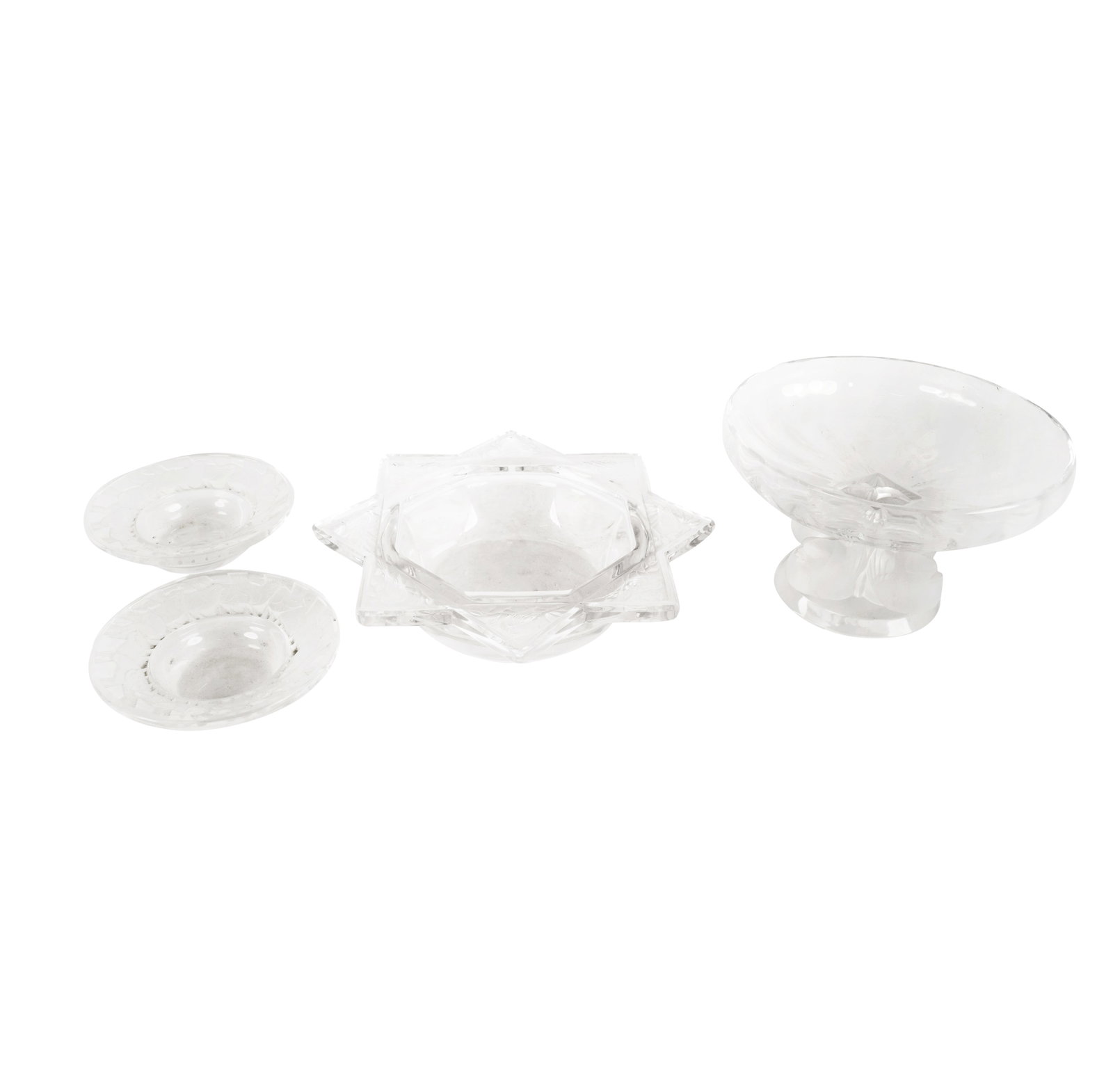 Four Lalique Glass Bowls: after 1945; each signed "Lalique France"Compote: 3 1/2 x 5 1/2 in. (8.9 x 14 cm.)Provenance: The Estate of Amalia Wechselmann, Beverly Hills