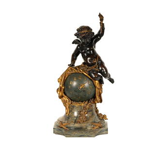 A French Figural Mantel Clock: gilt and patinated bronze and marble; movement with Samuel Marti "Medaille d'Or Paris 1900" pastille22 x 10 x 10 in. (55.9 x 25.4 x 25.4 cm.)
