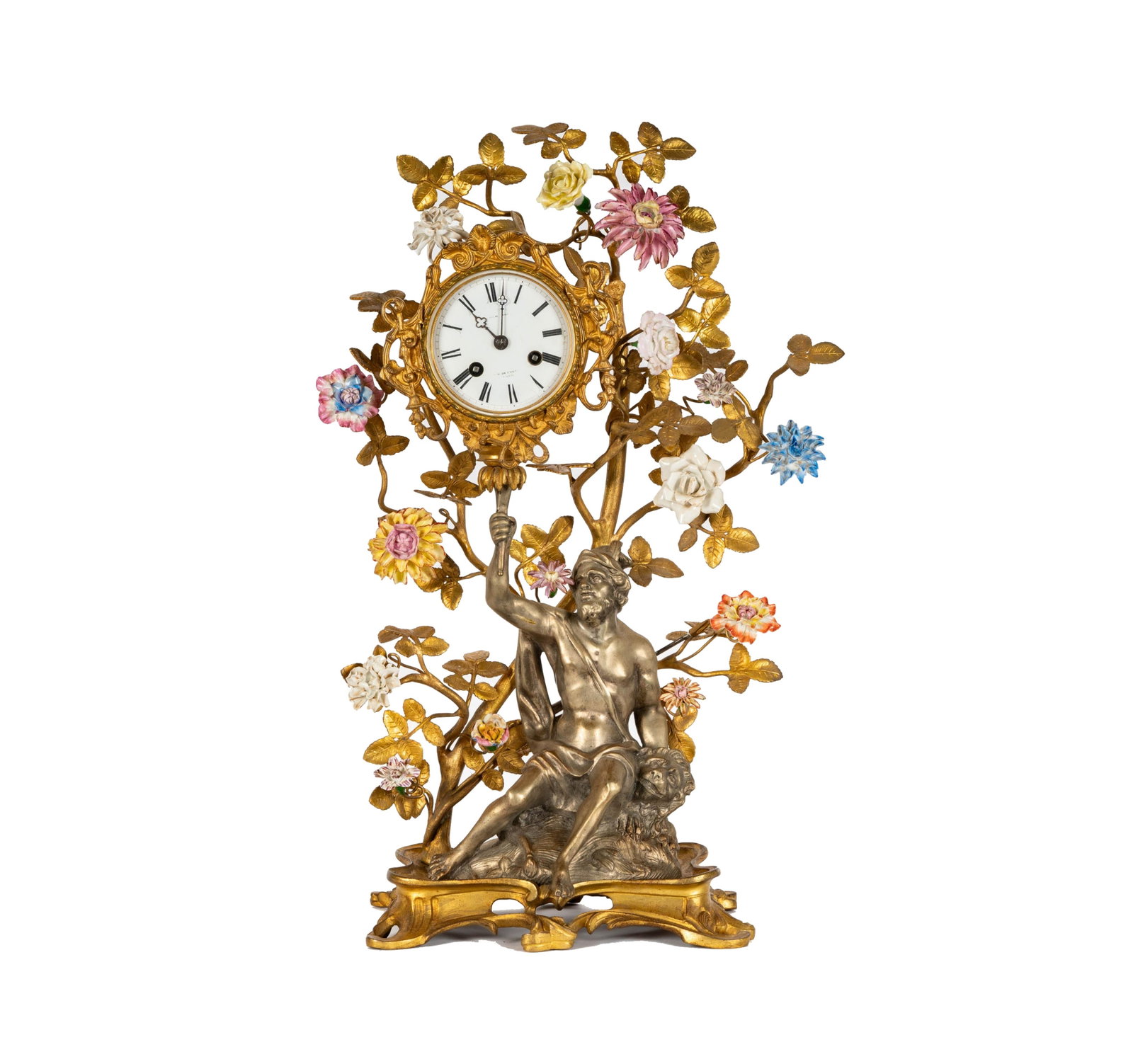 A Gilt and Silvered Metal and Porcelain Clock: the dial signed "[illegible] Rue de [illegible] Paris"20 x 13 x 6 1/2 in. (50.8 x 33 x 16.5 cm.)Notes: This item does not qualify for in-house shipping. Please see our preferred shippers' list for quo