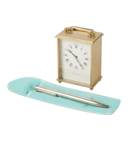 A Tiffany and Co. Brass Carriage Clock and Sterling Pen