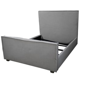 A Grey Fabric-Upholstered Bed