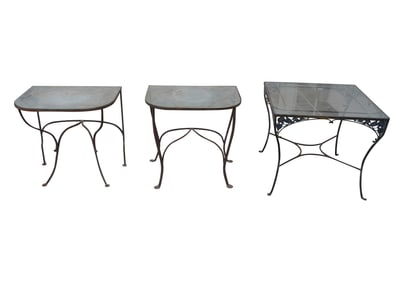 A Group of Metal and Glass Patio Tables