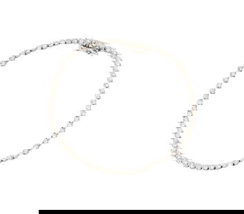 14 Karat White Gold and Diamond Line Bracele: set with 69 small round diamonds[I/I3] weighing approximately 1.10 carats; measuring 7-1/8 inches long by 2.44mm wide; weighing 3.6 grams;