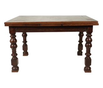 An English Oak Draw-Leaf Dining Table