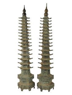 A Pair of Decorative Pagodas: second half 20th century; brass37 x 6 1/4 in. (94 x 15.9 cm.)Notes: This item does not qualify for in-house shipping. Please see our preferred shippers' list for quotes or arrange for local pickup. ht