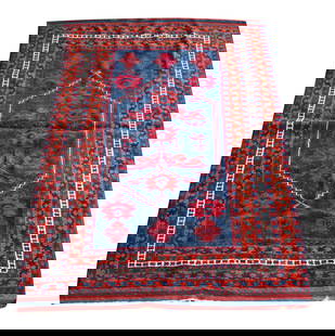 A Red and Blue Turkish or Persian Rug 5'8" x 3'6": wool on wool5'8" x 3'6"