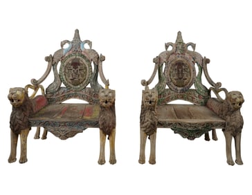 A Pair of Indonesian Carved and Polychromed Wood Armchairs
