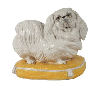 An Italian Ceramic Figure of a Dog on a Pillow