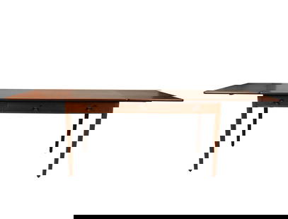 A Hans Wegner Teak Desk: Denmark, c. 197728 1/2 x 54 1/4 x 29 3/4 in. (72.4 x 137.8 x 75.6 cm.)Notes: This item does not qualify for in-house shipping. Please see our preferred shippers' list for quotes or arrange for local p