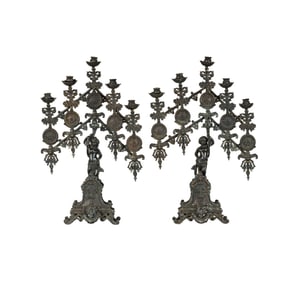 A Pair of Iron Figural Candelabra