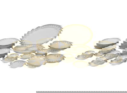 A Theodore Haviland Limoges Porcelain Service: including eight dinner plates, two platters, and three serving bowls; each piece marked "Theodore Haviland Limoges France"[Approximately 48 pieces]Notes: This item does not qualify for in-house shippi