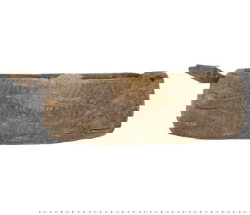 A Papua New Guinea Slit Drum: carved wood4 3/4 x 15 1/2 x 4 1/2 in. (12.1 x 39.4 x 11.4 cm.)