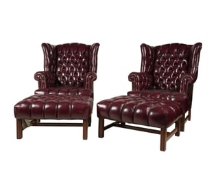 A Pair of Burgundy Wing Chairs and Ottomans