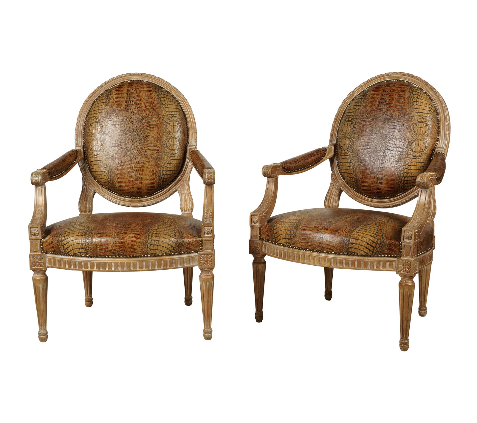 A Pair of Louis XVI-Style Fauteuile: 20th century; covered with embossed leather or faux leather38 1/2 x 26 x 20 in. (97.8 x 66 x 50.8 cm.), Seat height: 16 in. (40.6 cm.)Notes: This item does not qualify for in-house shipping. Please se