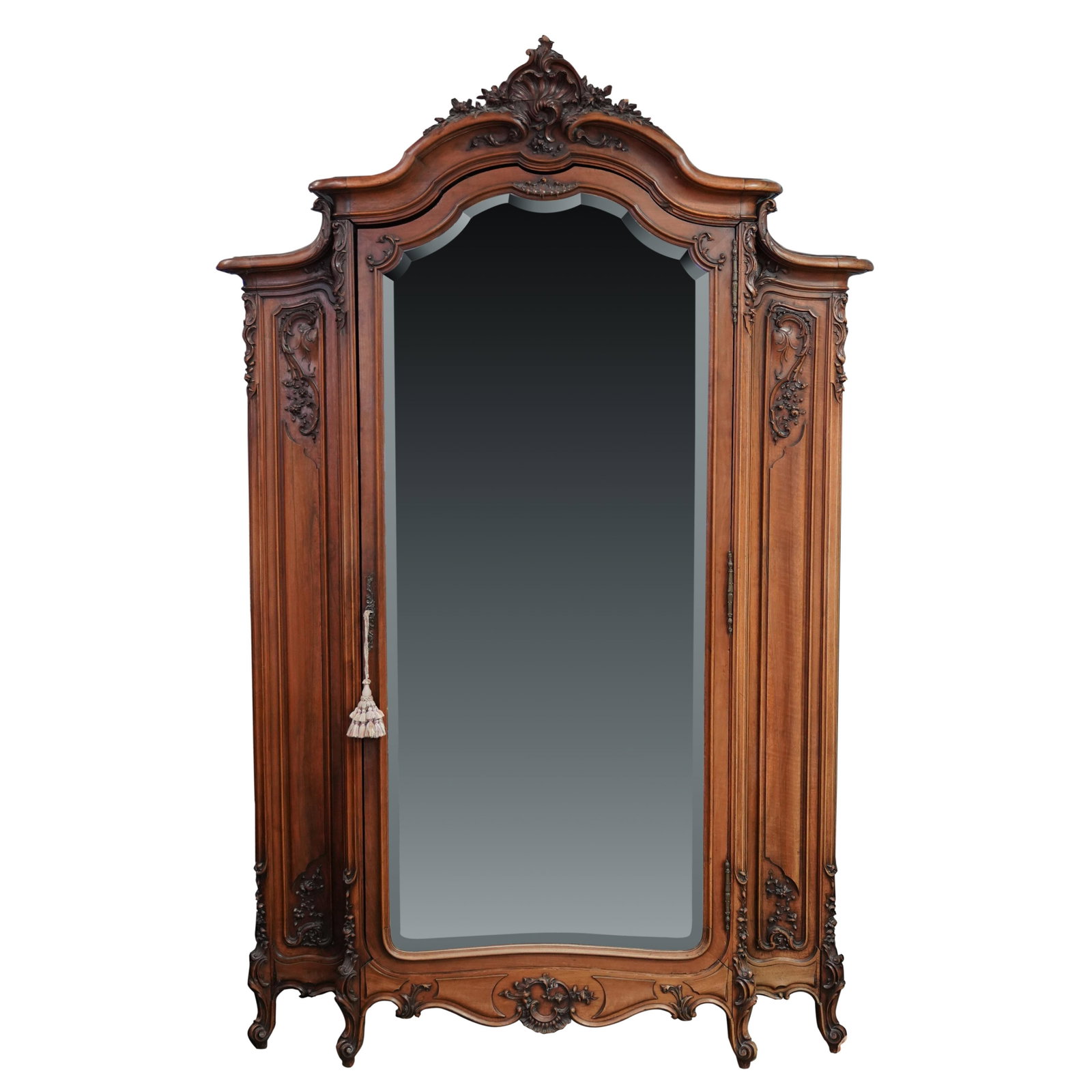 A Rococo Revival-Style Armoire: with key105 x 67 x 20 in. (266.7 x 170.2 x 50.8 cm.)Notes: This item does not qualify for in-house shipping. Please see our preferred shippers' list for quotes or arrange for local pickup. https://www