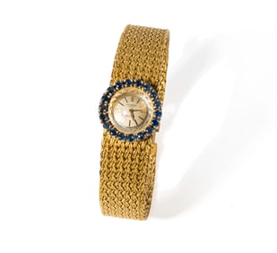 18-KARAT YELLOW GOLD MINIATURE SAPPHIRE WATCH UNIVERSAL GENEVE