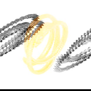 18-KARAT YELLOW GOLD SNAKE WRAP BRACELET: featuring a triple wrap snake skin motif bracelet with a snake head and triangle tail, two round faceted emeralds set for the eyes equaling approximately 0.14 carats, comprised of 18-karat yellow gold