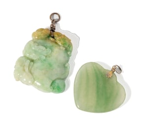 TWO CARVED JADE PENDANTS
