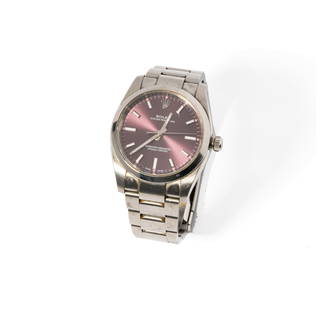 ROLEX STAINLESS STEEL OYSTER PERPETUAL 'RED GRAPE' DIAL WATCH: featuring a Rolex stainless steel Oyster Perpetual ?Red Grape? dial watch; dial measuring 25.72 mm in diameter; case measuring 33.80 mm in diameter; bracelet measuring 7"; serial number 077R9648