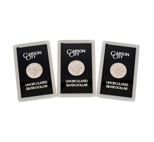 COLLECTION OF THREE 1884 MORGAN SILVER DOLLARS