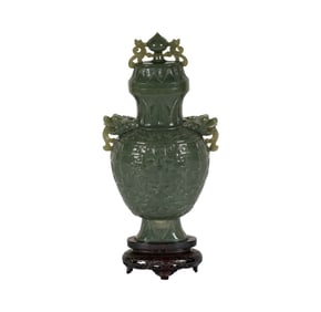 A Chinese Carved Green Stone Vase and Cover