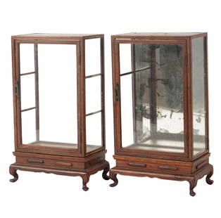 A Pair of Chinese Diminutive Vitrine Cabinets: each glazed, one with mirrored rear panel Each: 11 1/2 x 7 x 4 in. (29.2 x 17.8 x 10.2 cm.)Notes: This item does not qualify for in-house shipping. Please see our preferred shippers' list for quotes o