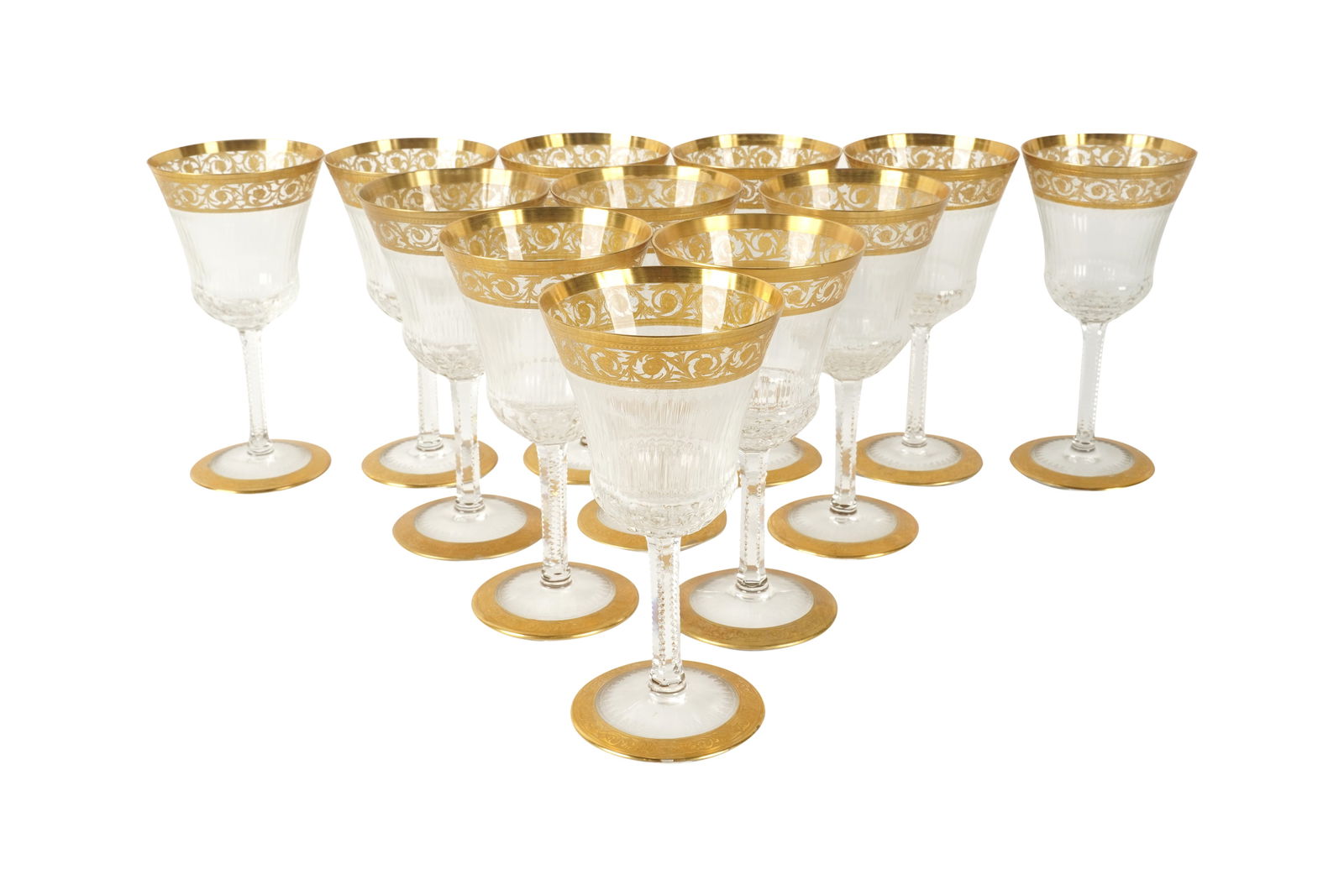 A Set of 12 Thistle Pattern Gilt Crystal Wine Glasses: identical to St. Louis; unmarkedEach 6 3/8 in. highNotes: This item does not qualify for in-house shipping. Please see our preferred shippers' list for quotes or arrange for local pickup. https://www.