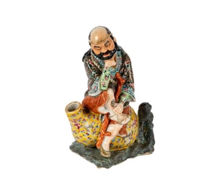 A Chinese Porcelain Figural Vessel