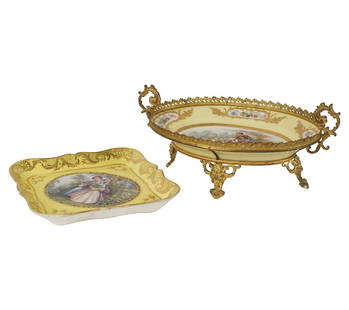 A Sevres-Style Porcelain Center Bowl and Plate: each hand-painted with figures in a landscape within gilt borders on a yellow ground; the bowl oval, with gilt metal mounts, Overall: 6 x 13 1/4 x 8 in. (15.2 x 33.7 x 20.3 cm.); the plate lozenge-sha