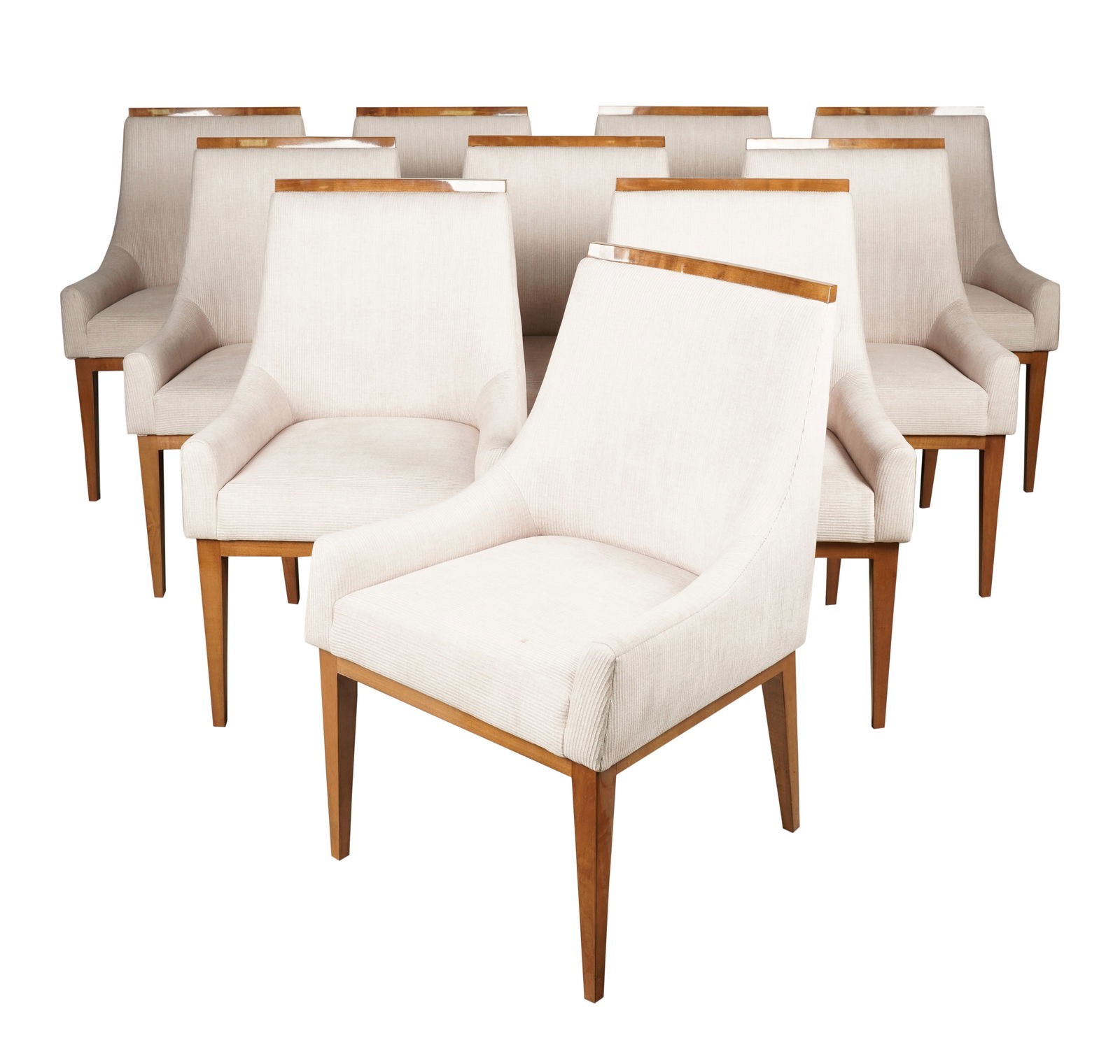 A Set of Ten Upholstered Dining Chairs: in the style of Kipp Stewart; covered with light beige fabric; unsigned37 1/4 x 24 x 23 in. (94.6 x 61 x 58.4 cm.), Seat height: 19 1/2 in. (49.5 cm.)Notes: This item does not qualify for in-house shi