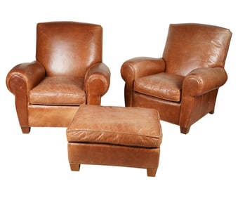 A Pair of Deco-Style Brown Leather Armchairs and an Ottoman