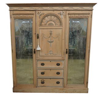 A Neoclassical-Style Pine Wardrobe Cabinet: in five parts, with two mirrored doors 80 1/2 x 75 1/2 x 22 in. (204.5 x 191.8 x 55.9 cm.)Notes: This item does not qualify for in-house shipping. Please see our preferred shippers' list for quotes or