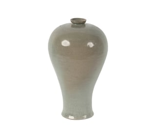 A Korean Celadon Incised Peony Maebyong Vase