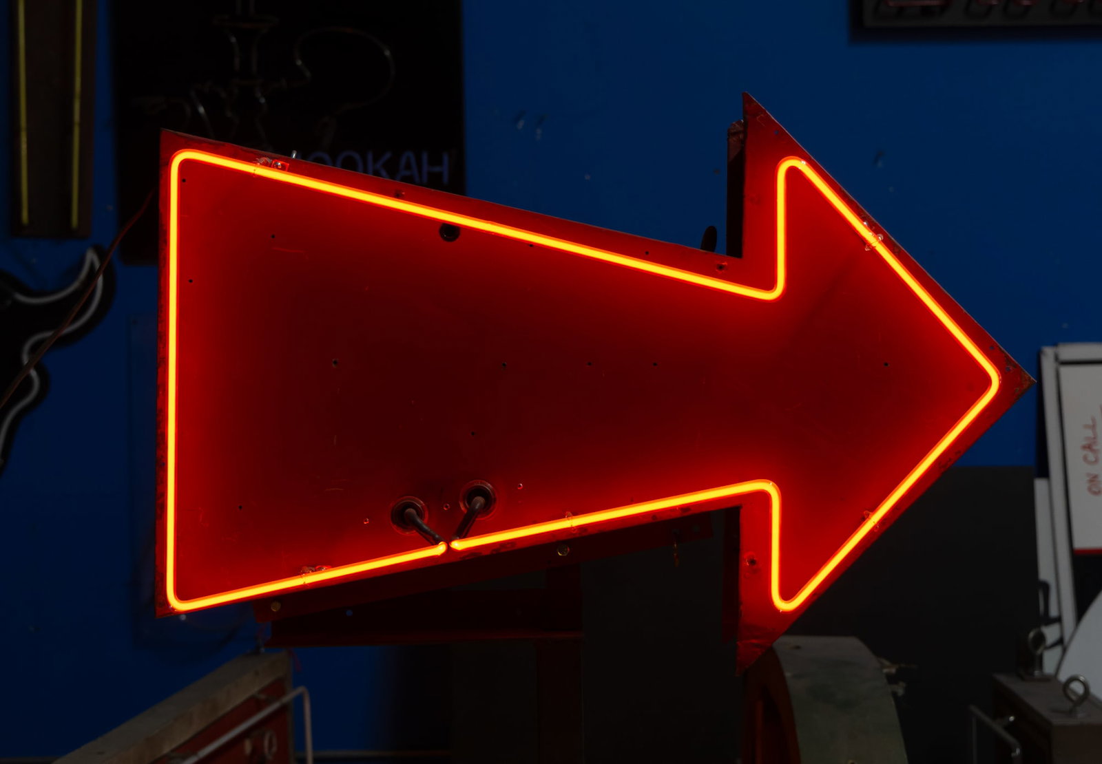 Vintage Red Neon Double-Sided Arrow: set on red painted metal arrow-shaped box on metal floor stand; transformer included inside; Red Arrow Only: 24 x 36 x 13 1/2 in. (61 x 91.4 x 34.3 cm.), Overall on Stand: 69 in. (175.3 cm.) high; Not