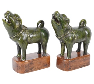 A Pair of Chinese Green-Glazed Ceramic Dog Figures
