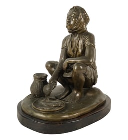 A Bronze Figure of an Asian Fisherwoman
