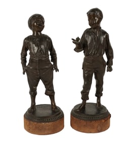 A Pair of Patinated Metal Figures of Children