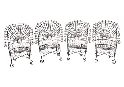 A Set of Four Iron Peacock Patio Armchairs