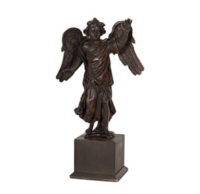 A Continental Carved Wood Figure of an Angel