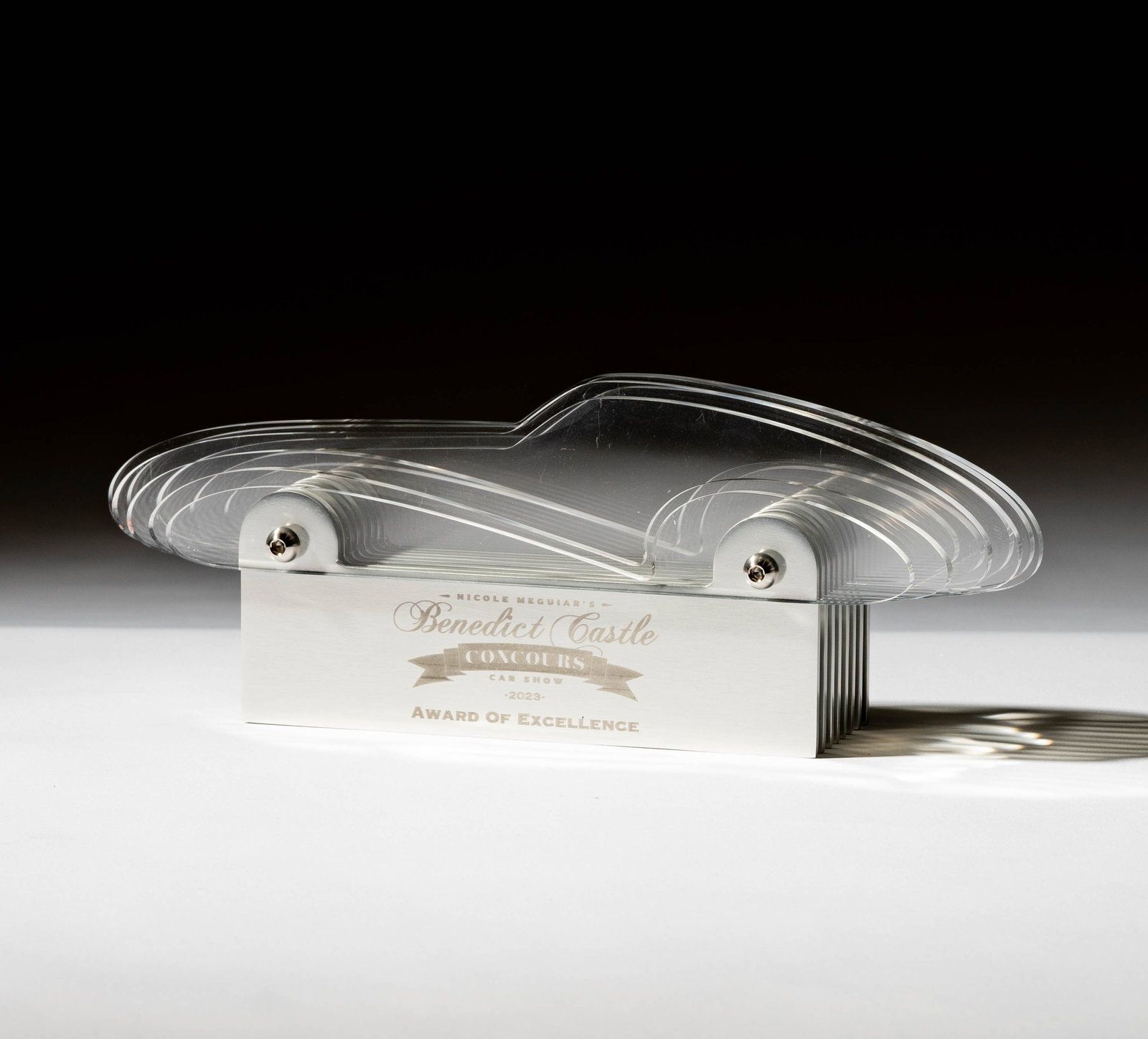 Nicole Meguiar's Benedict Castle Concours Car Show Award of Excellence: Award of Excellence 2023, acrylic segmented car on a metal base 4 1/2 x 12 x 3 1/2 in. (11.4 x 30.5 x 8.9 cm.)