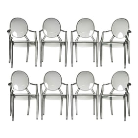 A Set of Eight Philippe Starck-Style Black Acrylic Stackable Armchairs