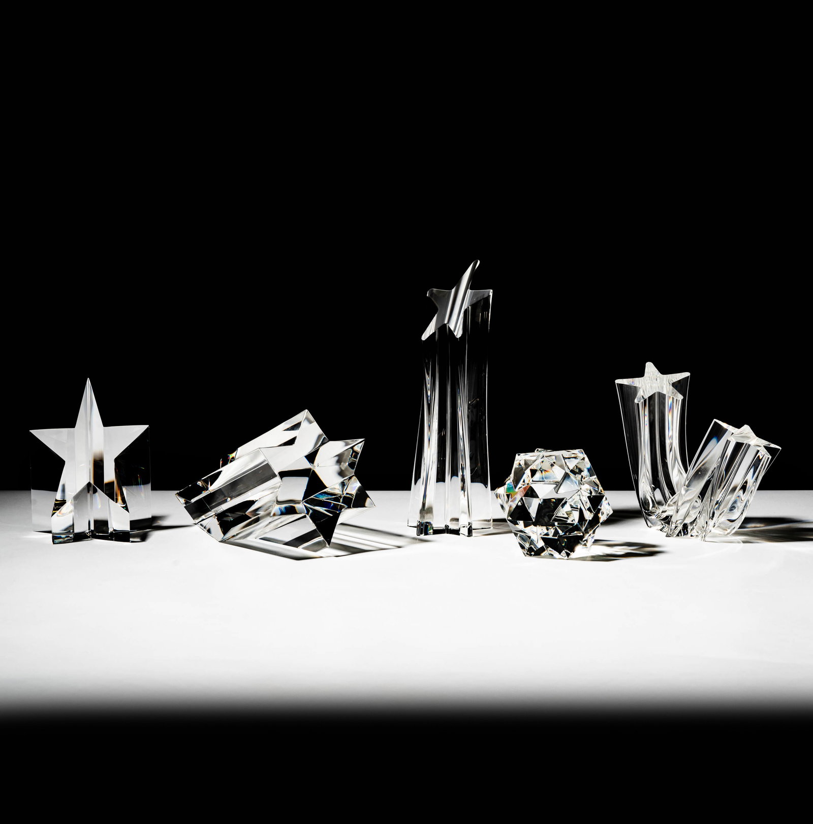 Five Steuben Glass Star-Form Sculptures: each signed; Ranging from 2 3/4 in. high to 8 in. (20.3 cm.) high; ; Provenance: The collection of Santa Barbara Steuben collector Joel Kreiner