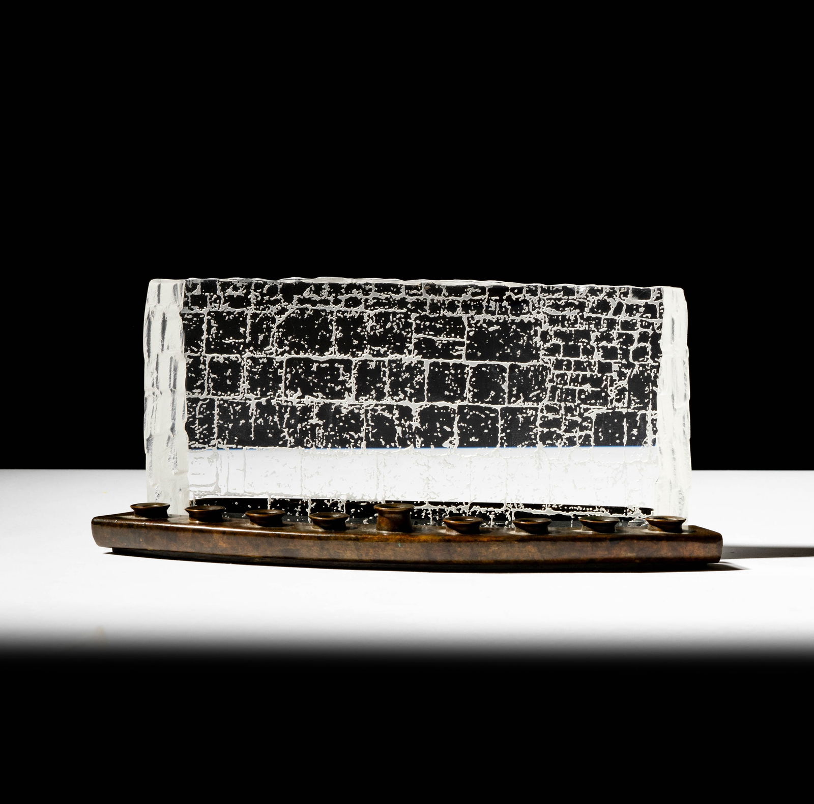 Steuben Glass and Bronze Wailing Wall Menorah: in two parts; signed; Overall: 4 x 9 3/4 x 3 1/2 in. (10.2 x 24.8 x 8.9 cm.); ; Provenance: The collection of Santa Barbara Steuben collector Joel Kreiner