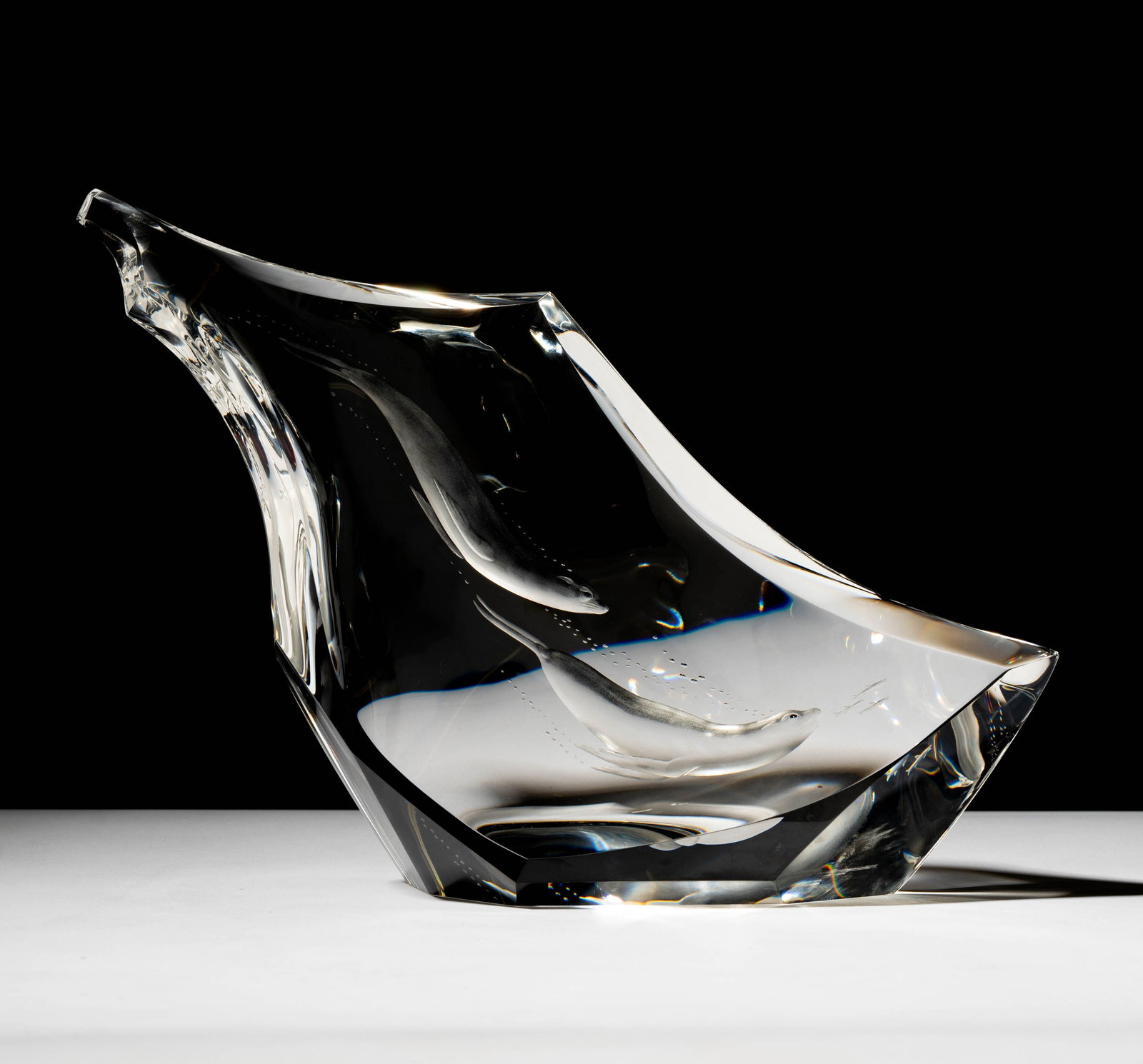 Steuben Glass Diving Seals Sculpture: designed by James Houston; signed and numbered 4/10; 8 1/2 x 11 3/4 x 3 1/2 in. (21.6 x 29.8 x 8.9 cm.); With original red leather fitted case; 5 1/4 x 15 1/2 x 13 1/4 in. (13.3 x 39.4 x 33.7 cm.); Pr