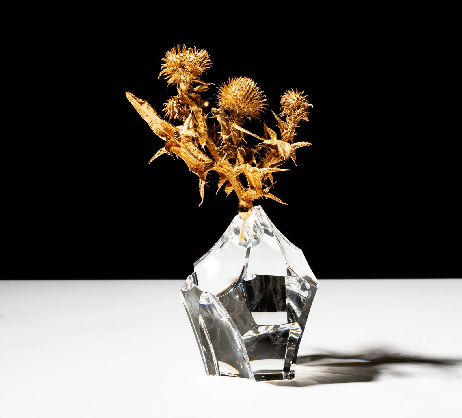 Steuben Glass and Vermeil Thistle Sculpture: signed; 7 3/4 in. (19.7 cm.) high; ; Provenance: The collection of Santa Barbara Steuben collector Joel Kreiner
