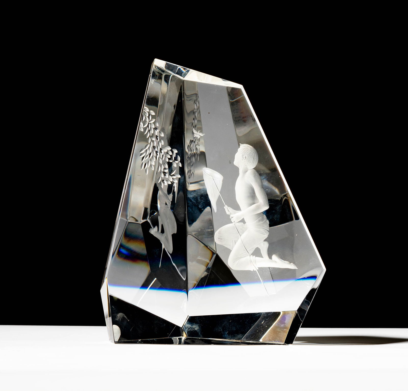 Steuben Glass Boy and Butterfly Sculpture: designed by George Thompson, engraving designed by Tom Vincent; signed and numbered 3/5; 8 x 6 1/4 x 3 1/2 in. (20.3 x 15.9 x 8.9 cm.); ; Provenance: The collection of Santa Barbara Steuben collector