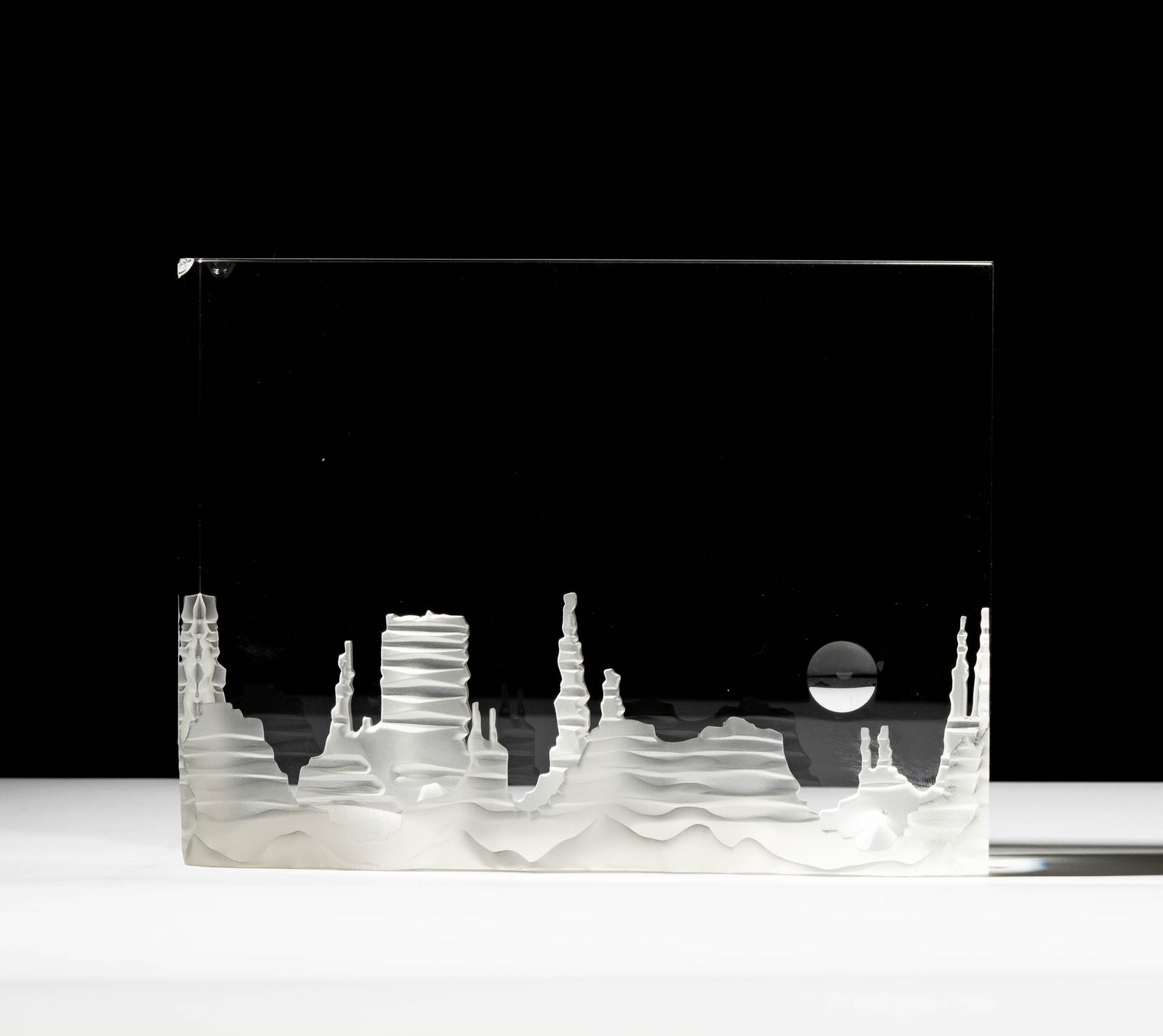 Steuben Glass Monument Valley Sculpture: designed by Bernard X. Wolff; signed; 6 1/2 x 8 3/4 x 2 3/4 in. (16.5 x 22.2 x 7 cm.); With original red leather fitted case: 4 3/4 x 12 3/4 x 10 1/4 in. (12.1 x 32.4 x 26 cm.); Provenance: The collec