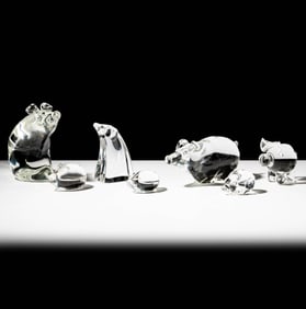 Seven Steuben Glass Pig Sculptures