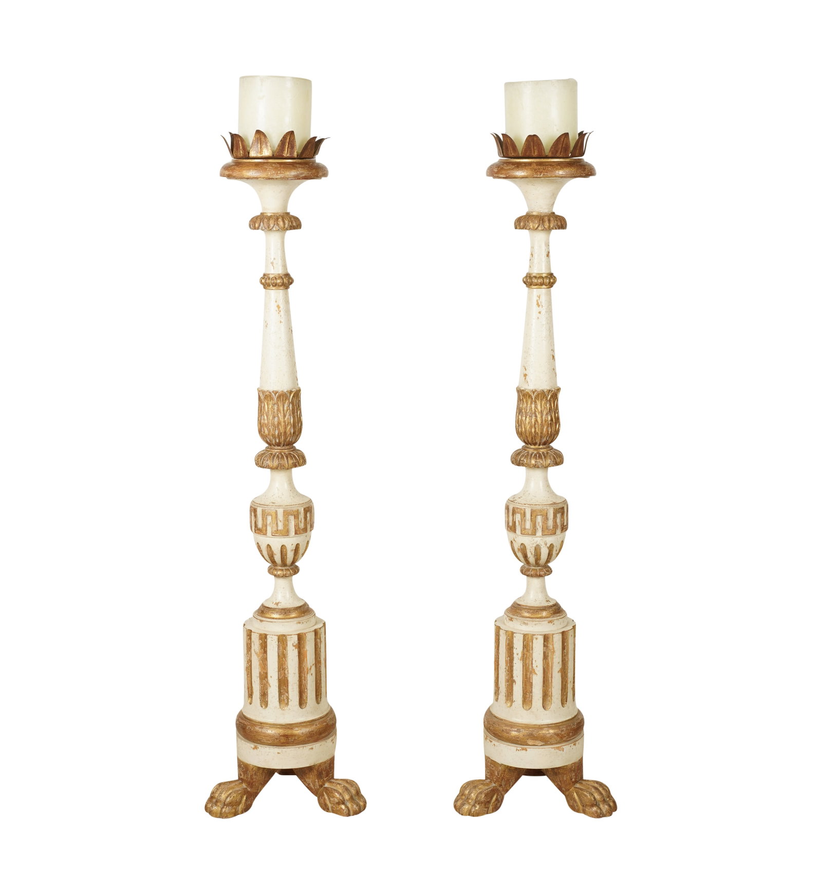 A Pair of Italian Baroque-Style Gilt And White-Painted Wood Torchieres: after 1950; each with a round platform with a gilt metal rim, and a wax candle Each 59 in. (149.9 cm.) high excluding candle Notes: This item does not qualify for in-house shipping. Please see our pre