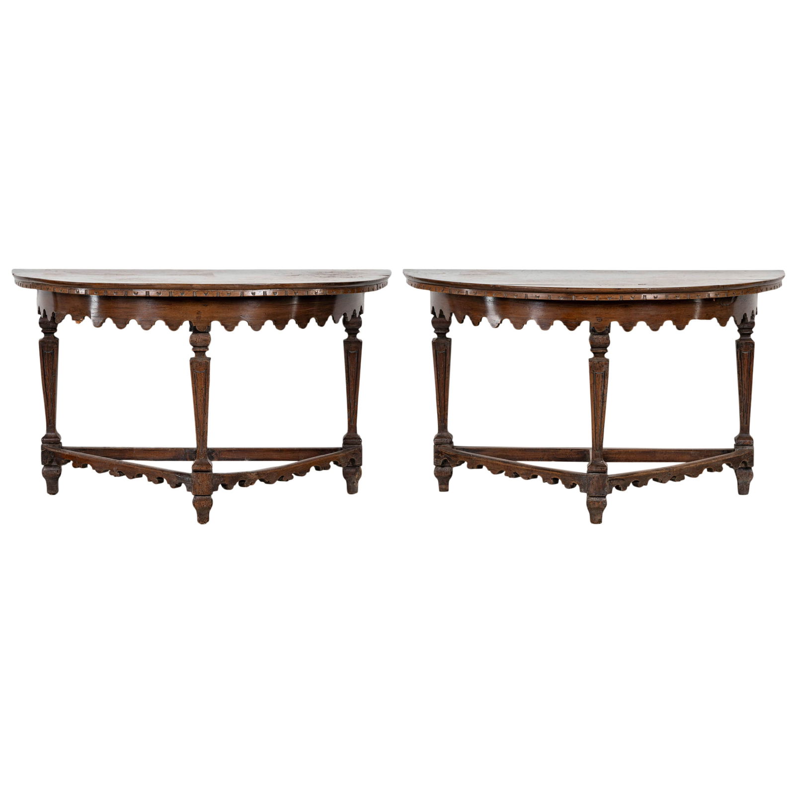 A Pair of Italian Baroque Walnut Console Tables: 17th/18th century 30 1/2 x 51 1/2 x 25 3/4 in. (77.5 x 130.8 x 65.4 cm.) Provenance: An Important Private Southern California Estate;Notes: This item does not qualify for in-house shipping. Please see